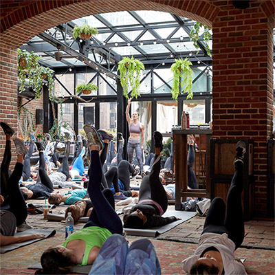 People on a rooftop doing yoga