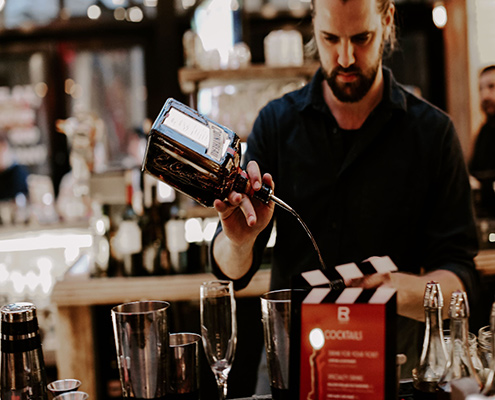 Bartender making a drink at, Refinery Rooftop